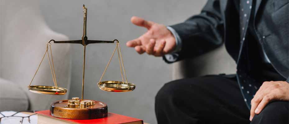 Scales of justice and lawyer gesturing
