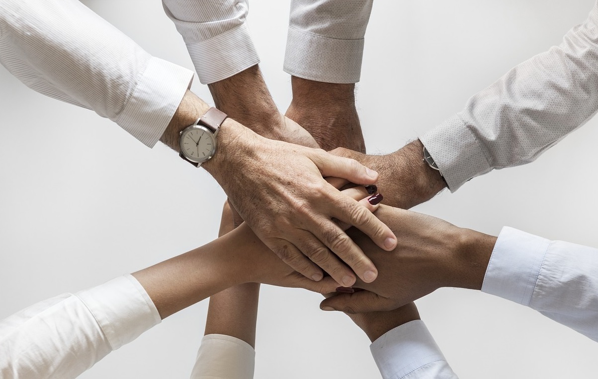 Team hands together in unity