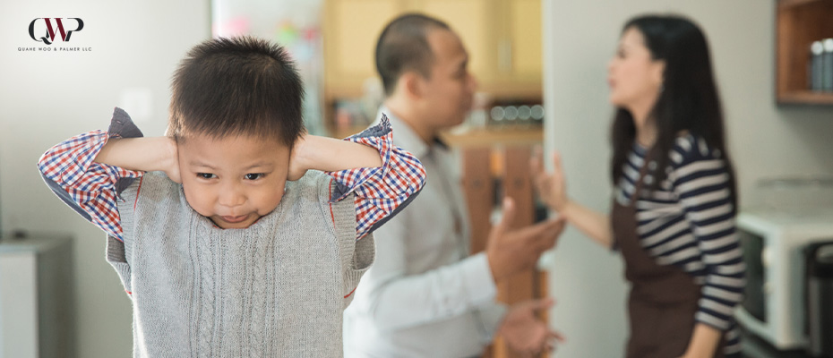 Image of a child in between fighting parents