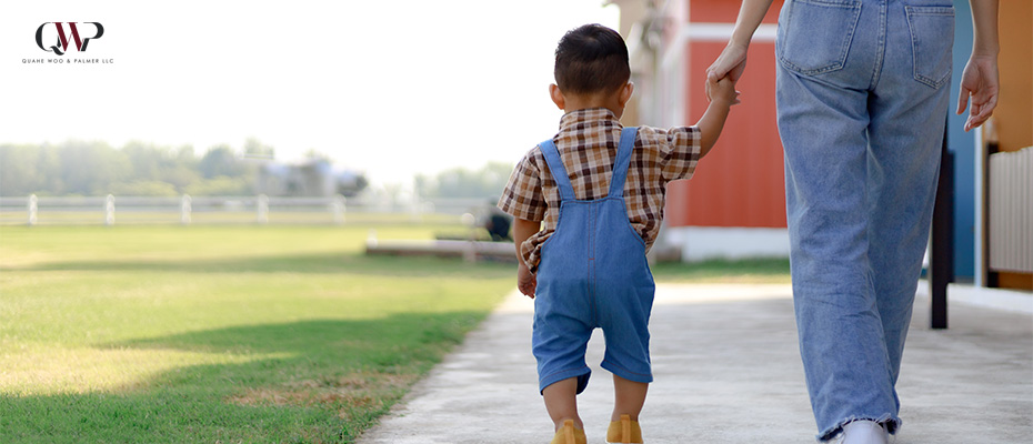 Image of a parent bringing a child out