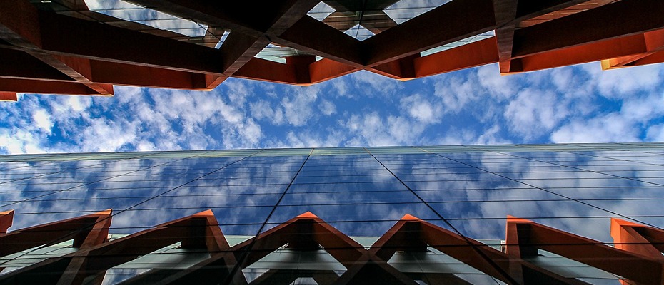 Upward view of modern architecture and sky